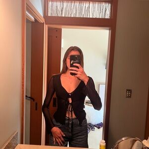 Mesh front tie long sleeve top.